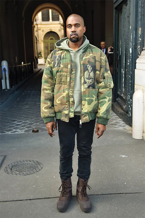 Kanye west wearing Raf Simons' Riot bomber jacket