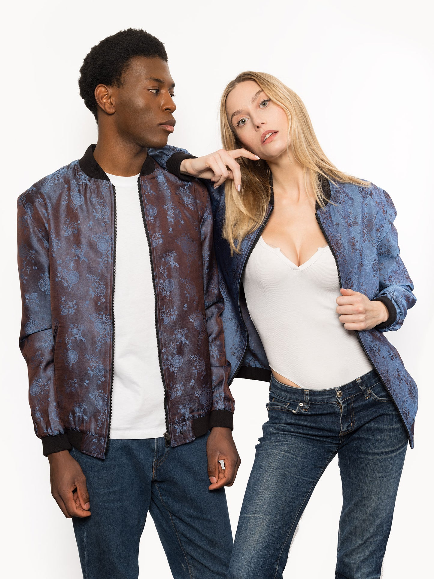 "Kaelu's limited edition 'DJINN' silk bomber jacket, numbered 1 to 20. Handcrafted in Vietnam with authentic Vietnamese silk, this reversible jacket offers versatility with one side in dark gray and the other in blue gray. Combining Asian luxury with urban style, it's fairtrade and fashion-forward, epitomizing streetwear sophistication."