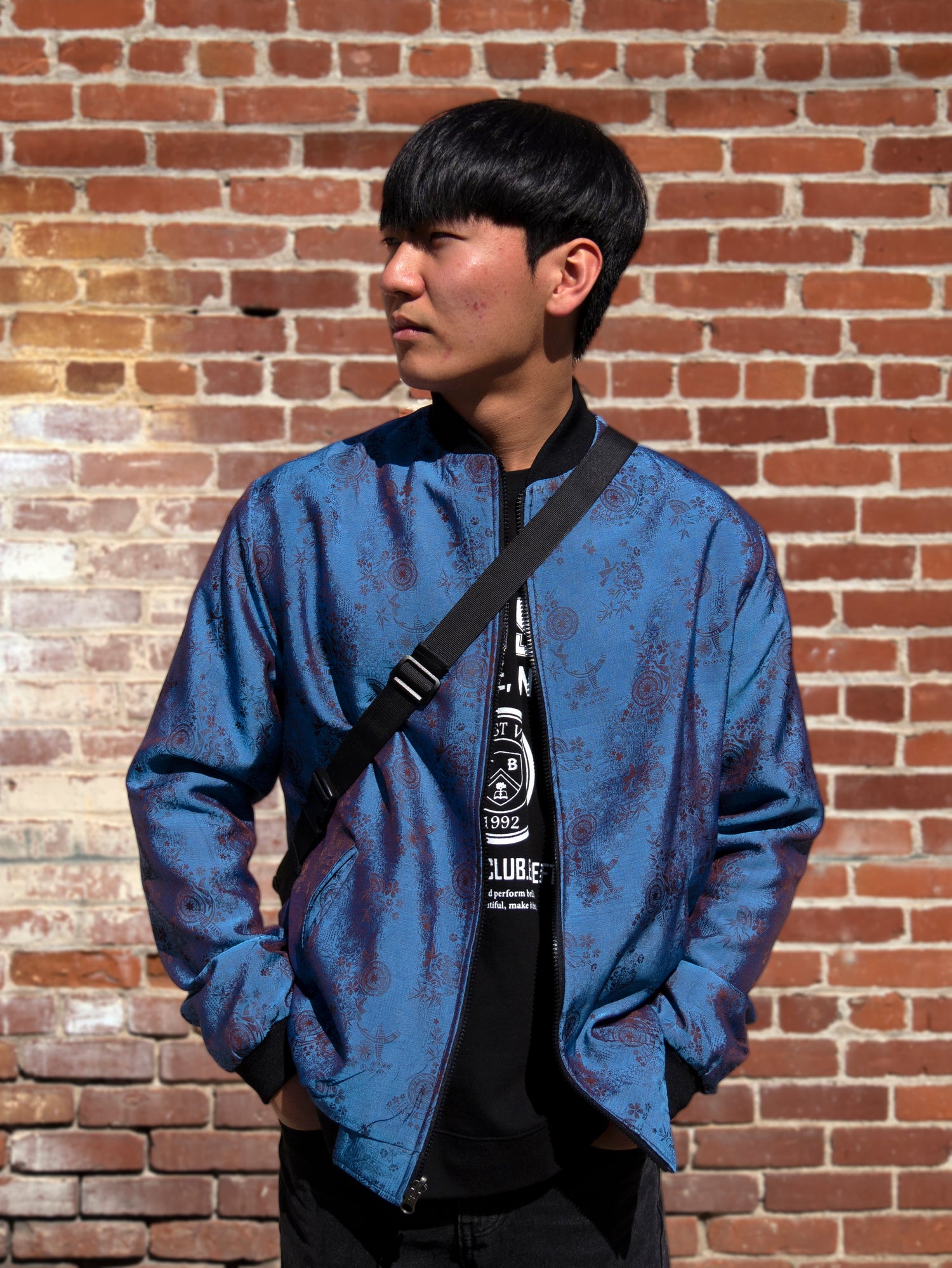 Kaelu's bomber jacket made of silk. A modern tribute to the japanese sukajan.